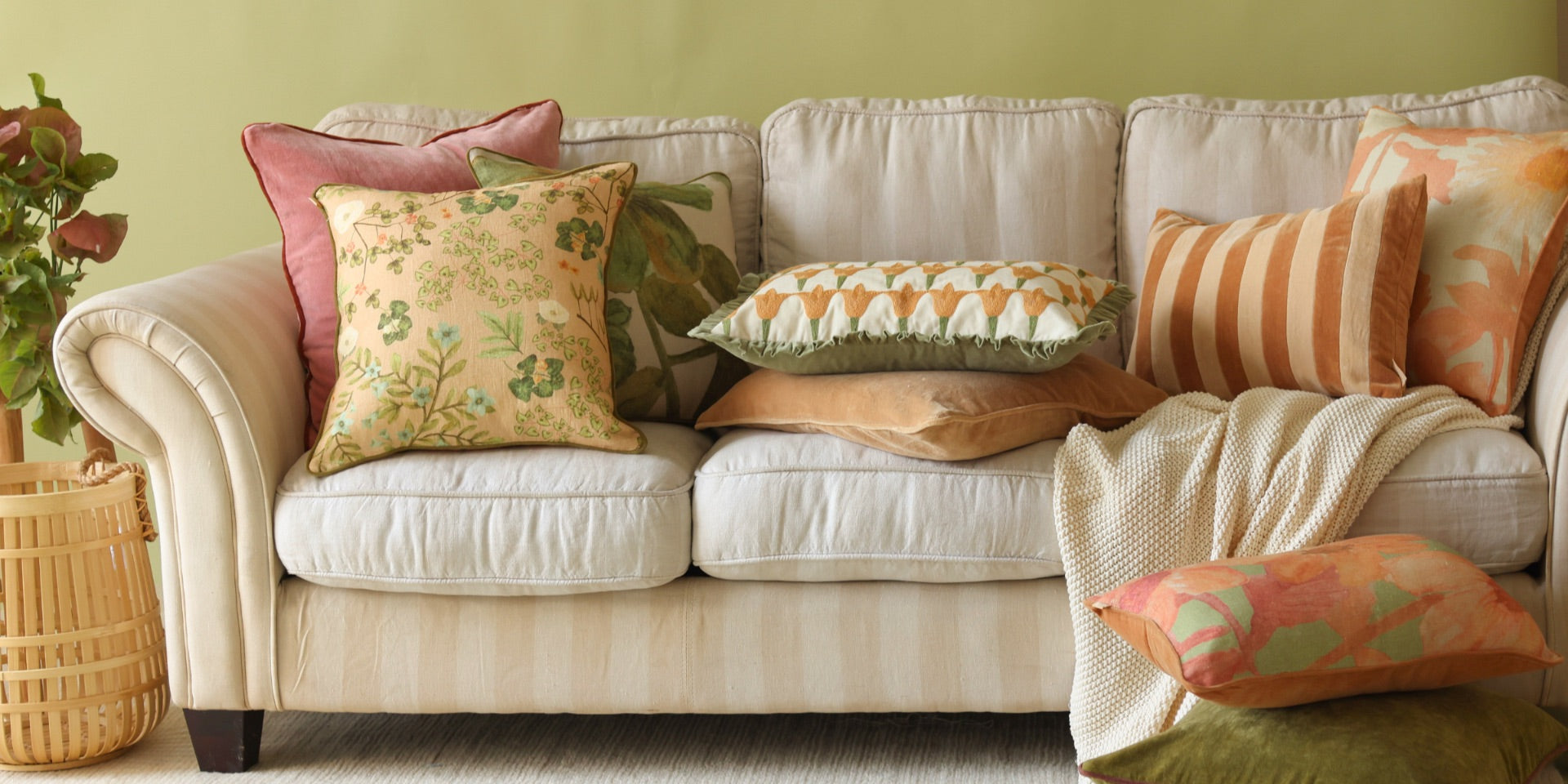 Elegant home interior colour featuring a stylish couch arrayed with cotton throw pillows and velvet sofa pillow covers.